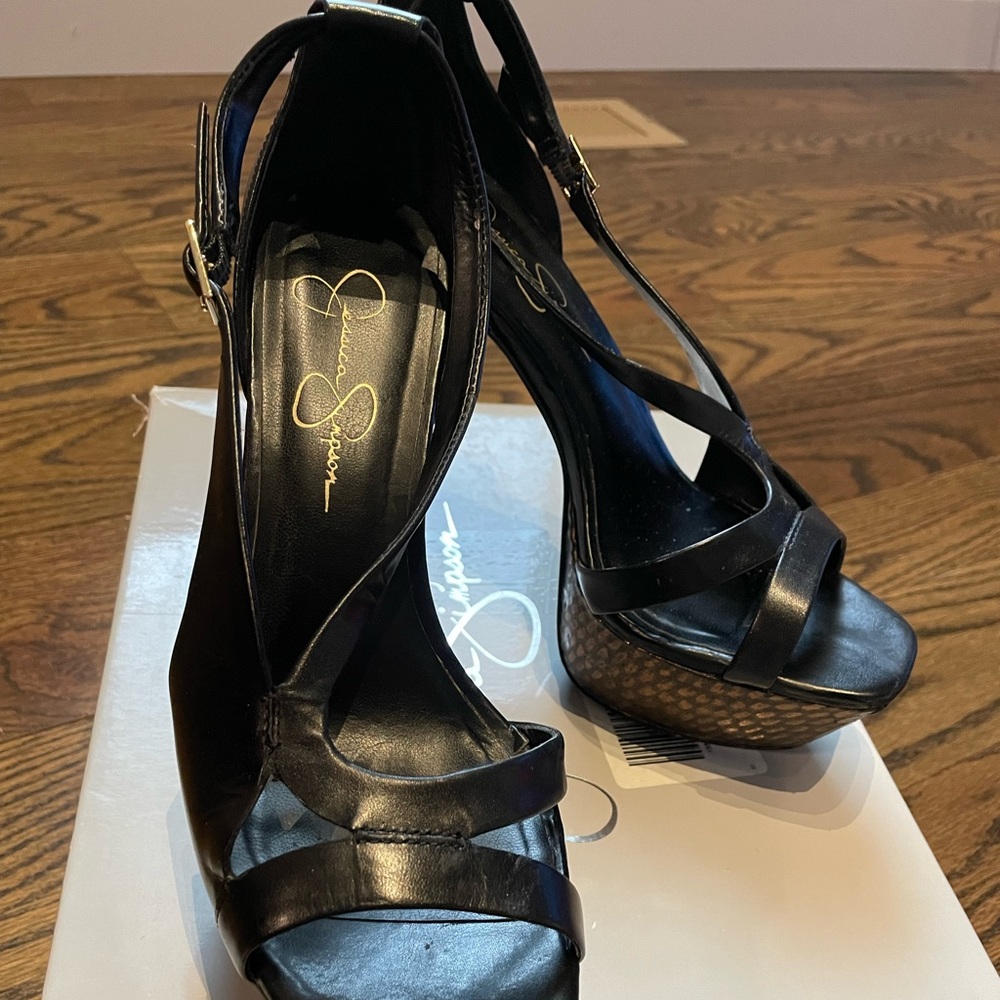 Black platformed heels with golden spot design on platform and heel, size 7.5